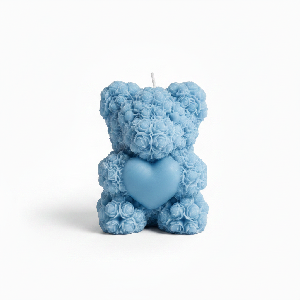Soft blue rose-textured teddy bear candle with heart detail on white background