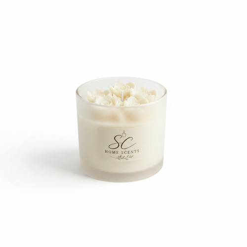 Cream frosted glass floral top candle with sculpted wax flowers on white background